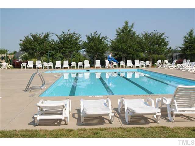 3812 Hopper Street Raleigh, NC 27616 - Photo 19 of 19 a view of swimming pool with outdoor seating and plants
