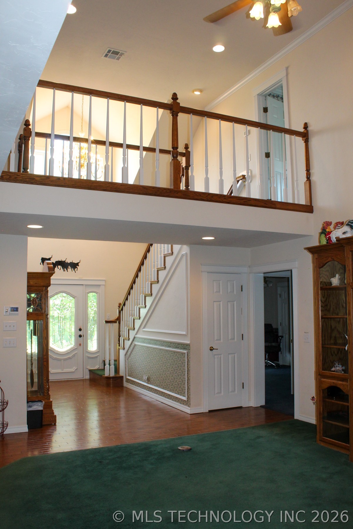 13248 North 3540th Road Maud, OK 74854 - Photo 54 of 98 Interior with a second-story balcony featuring wood railing and white balusters