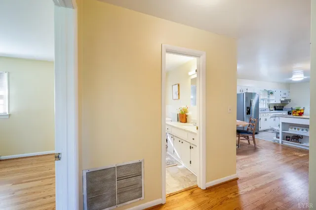 a view of a kitchen from the hallway