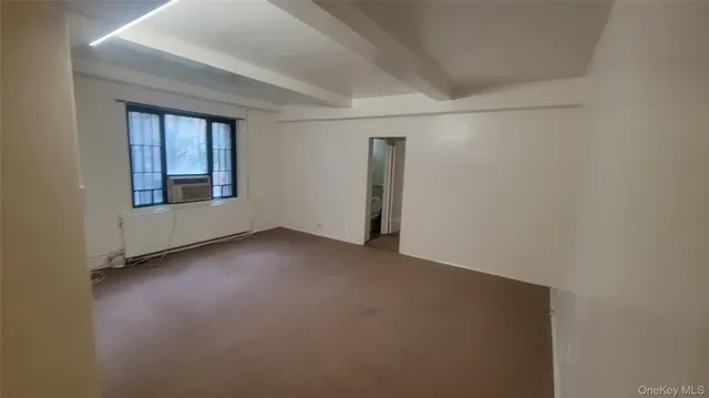 a view of a room that has a window in it