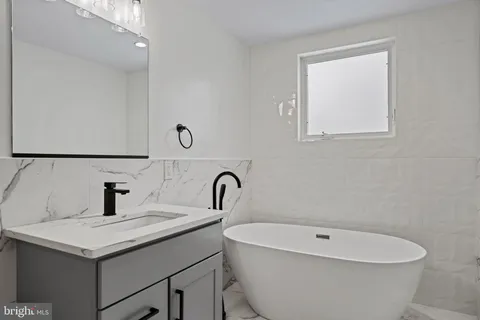 a bathroom with a sink and a bathtub