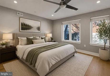 a bedroom with bed and a window