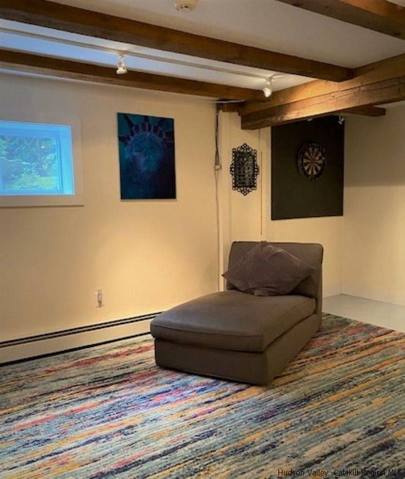 41 Stokes Way High Falls, NY 12440 - Photo 23 of 35 a living room with a bed and a dresser