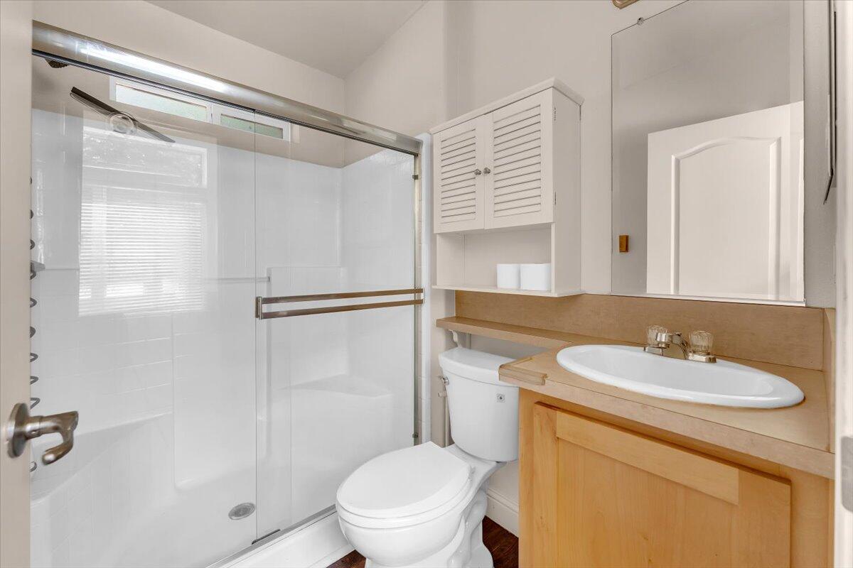 8495 Sky Tree Lane Shingletown, CA 96088 - Photo 20 of 55 a bathroom with a sink toilet and shower