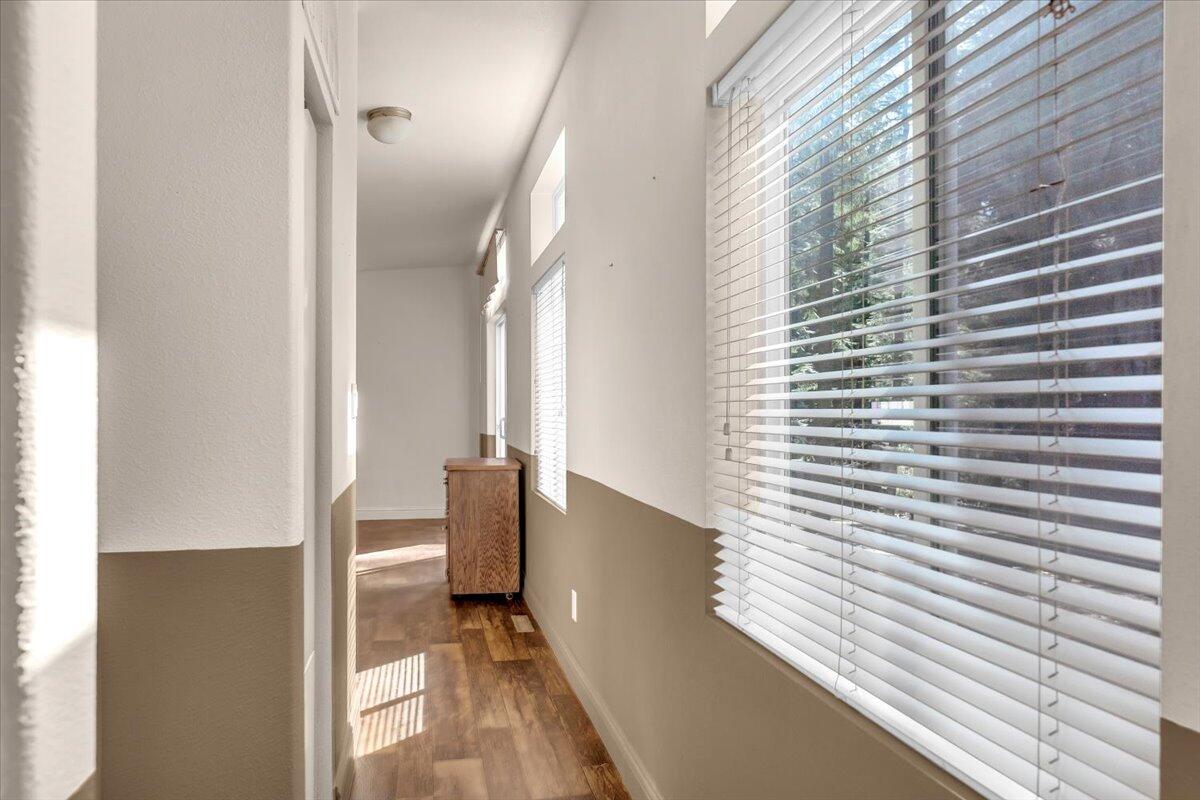 8495 Sky Tree Lane Shingletown, CA 96088 - Photo 22 of 55 a view of a hallway with windows