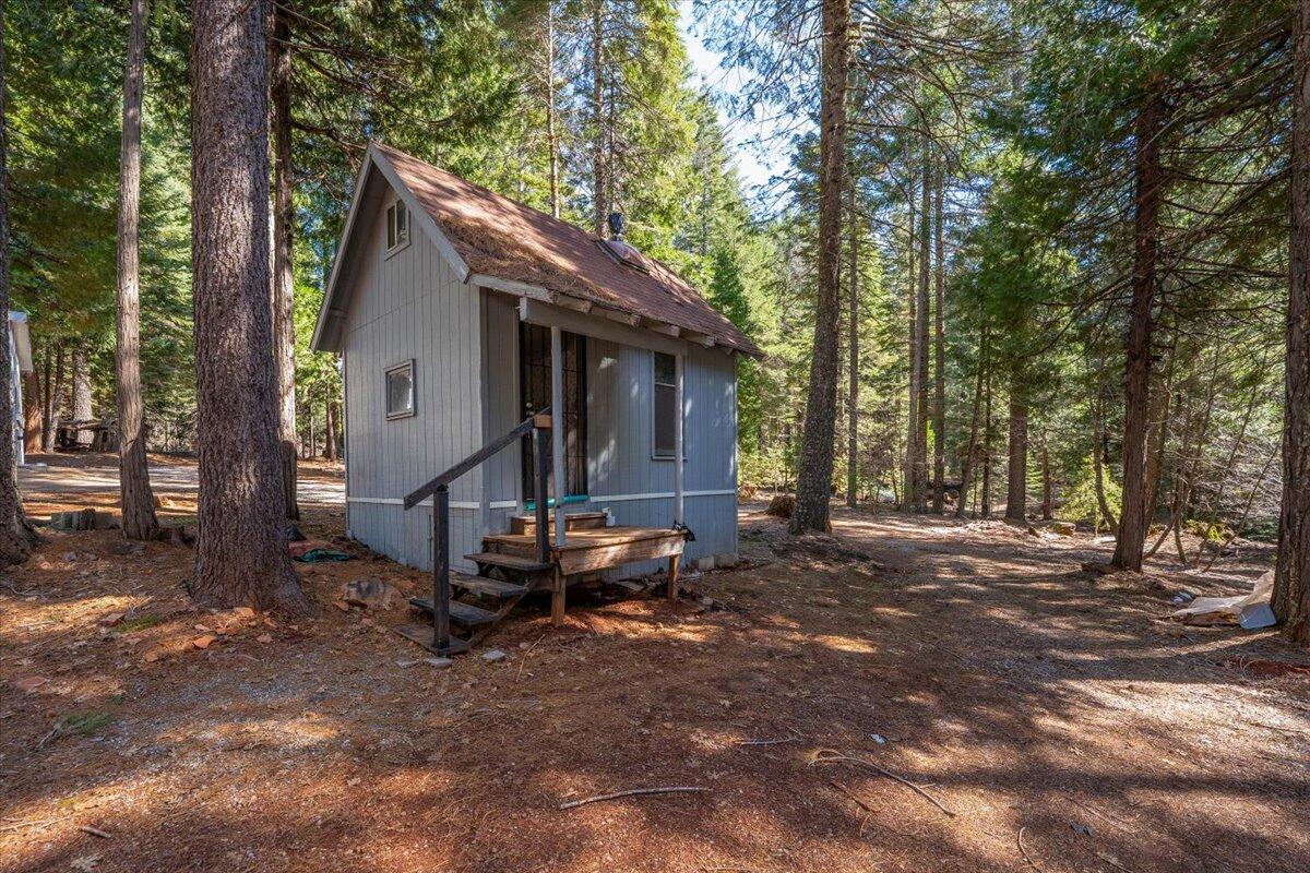 8495 Sky Tree Lane Shingletown, CA 96088 - Photo 31 of 55 a view of a house with backyard