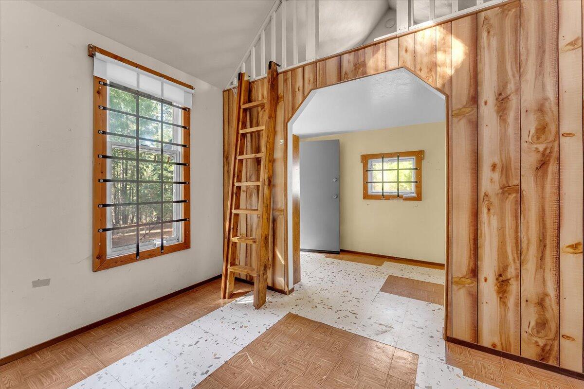 8495 Sky Tree Lane Shingletown, CA 96088 - Photo 8 of 55 a view of livingroom with window and hardwood floor