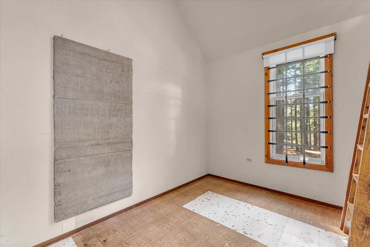 8495 Sky Tree Lane Shingletown, CA 96088 - Photo 9 of 55 an empty room with windows
