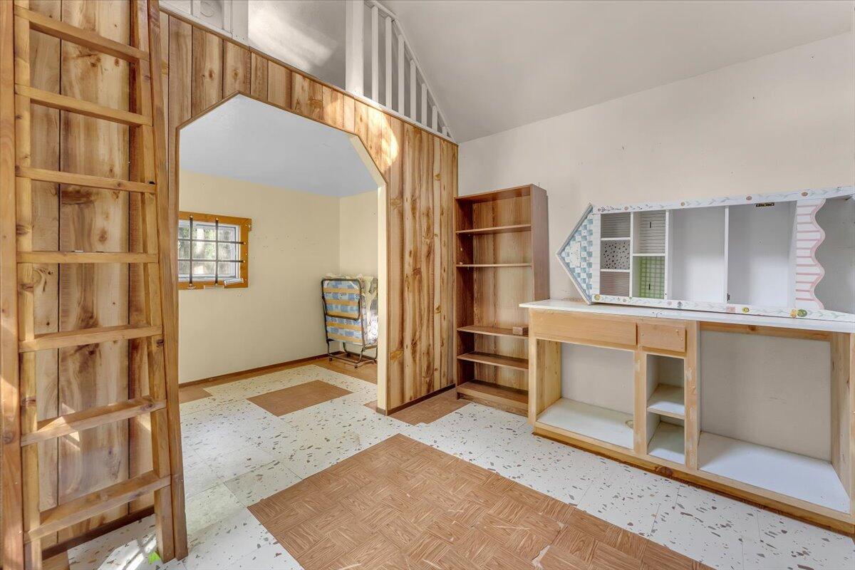 8495 Sky Tree Lane Shingletown, CA 96088 - Photo 10 of 55 a view of an empty room with cabinet and windows