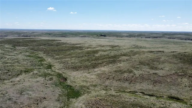 a view of an ocean beach and mountain