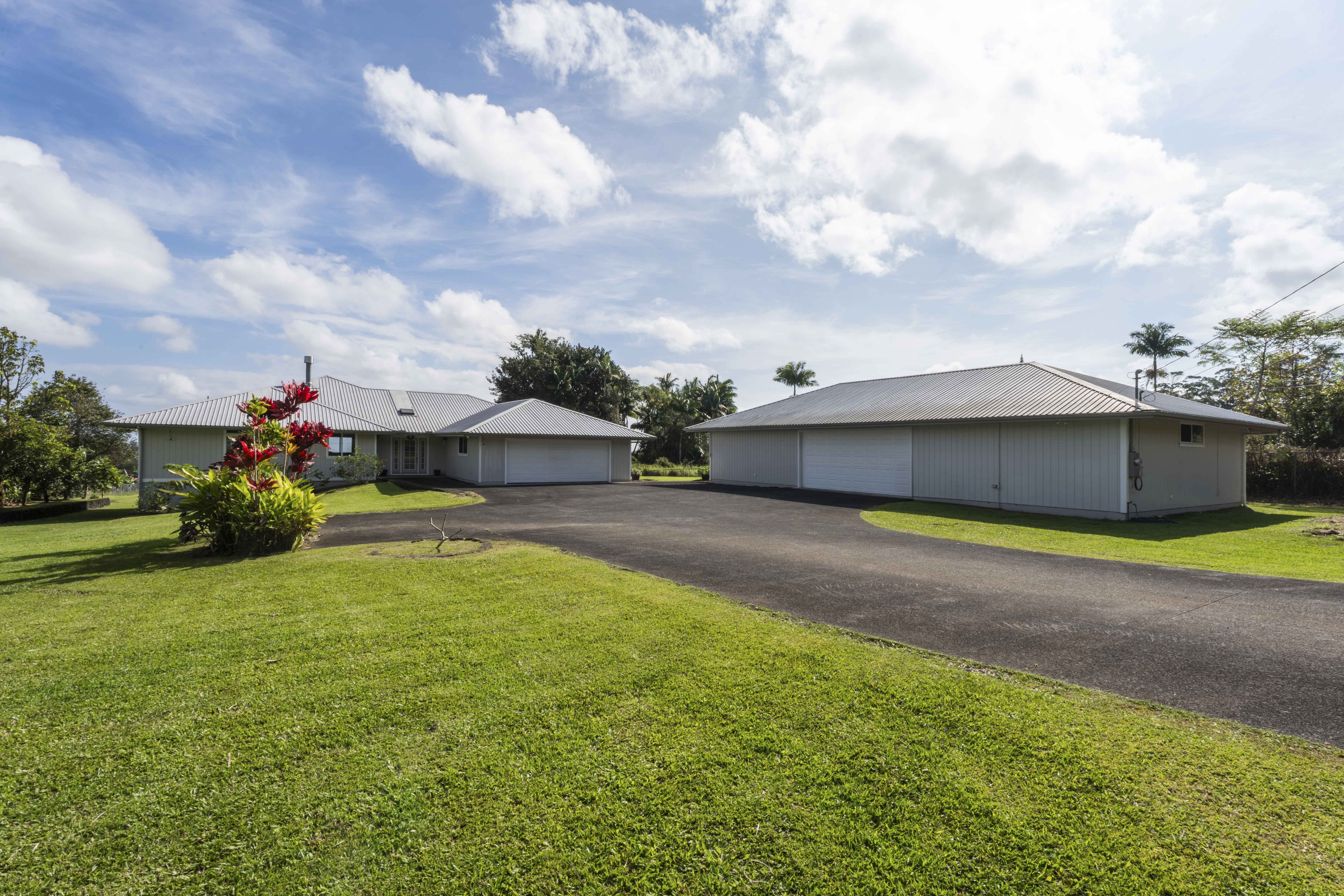 18-3970 Canney Road Mountain View, HI 96771 - Photo 1 of 30 a view of a house with a yard