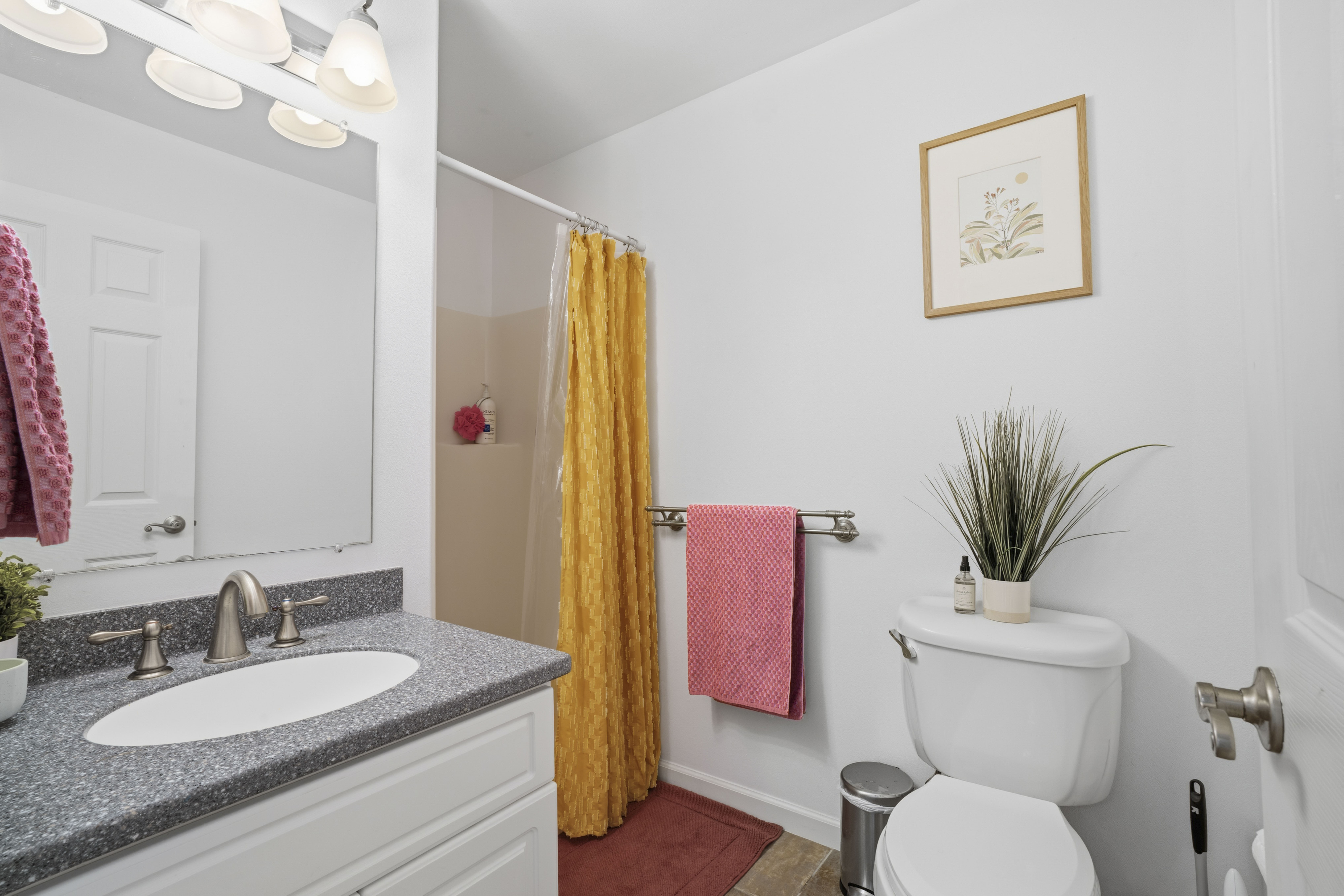 18-3970 Canney Road Mountain View, HI 96771 - Photo 15 of 30 a bathroom with a granite countertop sink vanity mirror and toilet