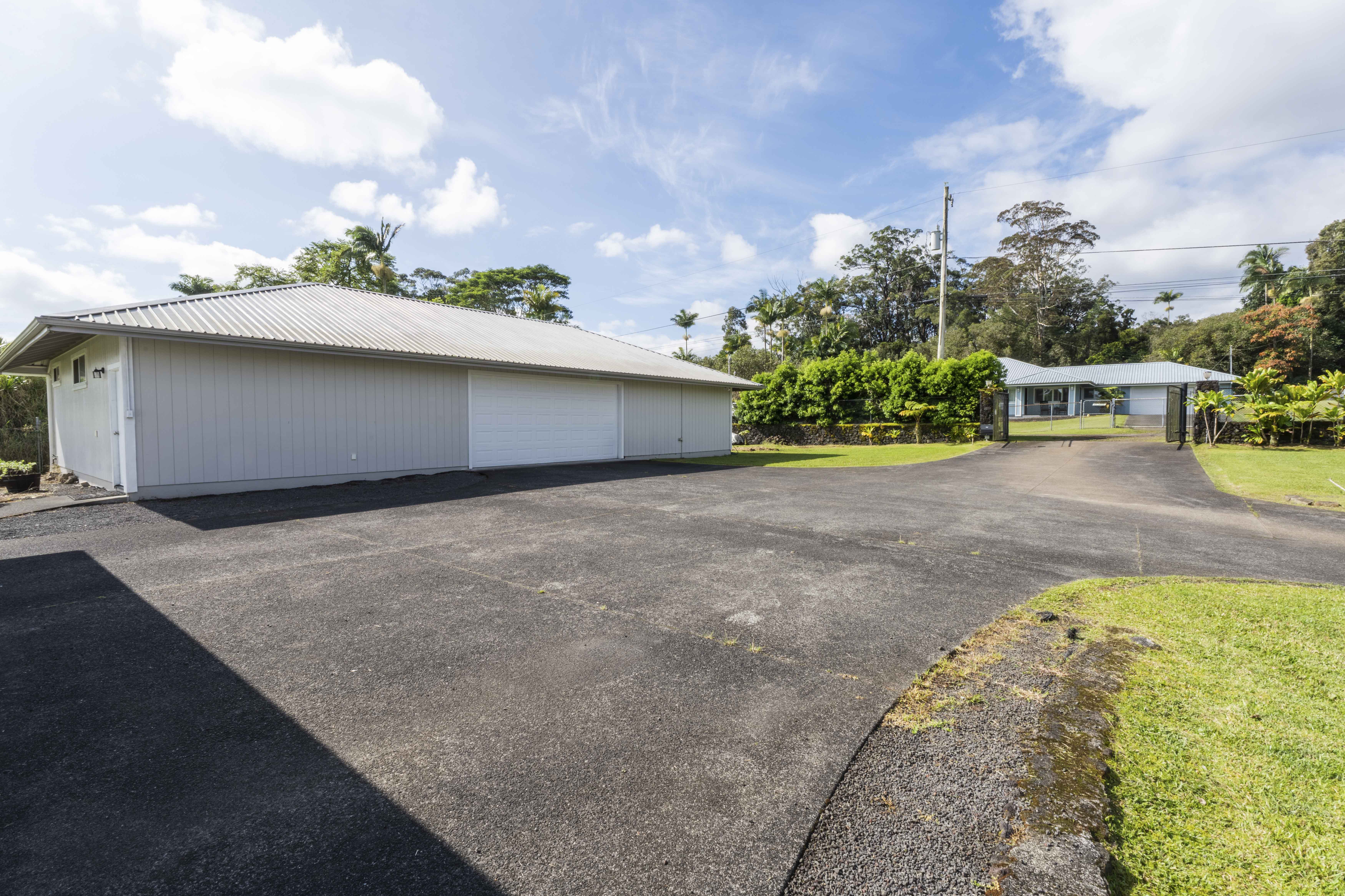 18-3970 Canney Road Mountain View, HI 96771 - Photo 28 of 30 a backyard of a house with table and chairs