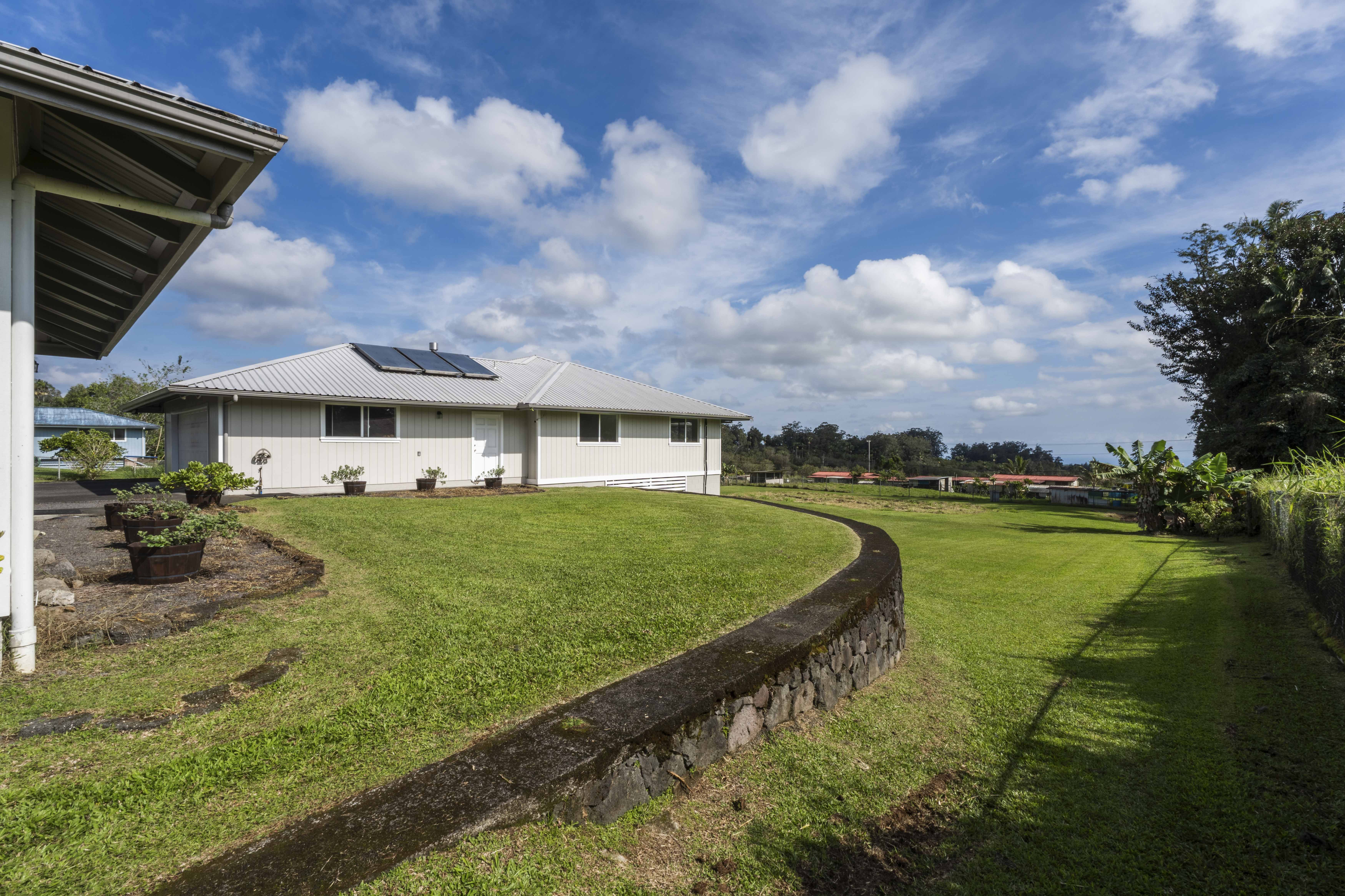 18-3970 Canney Road Mountain View, HI 96771 - Photo 29 of 30 a view of a house with a yard