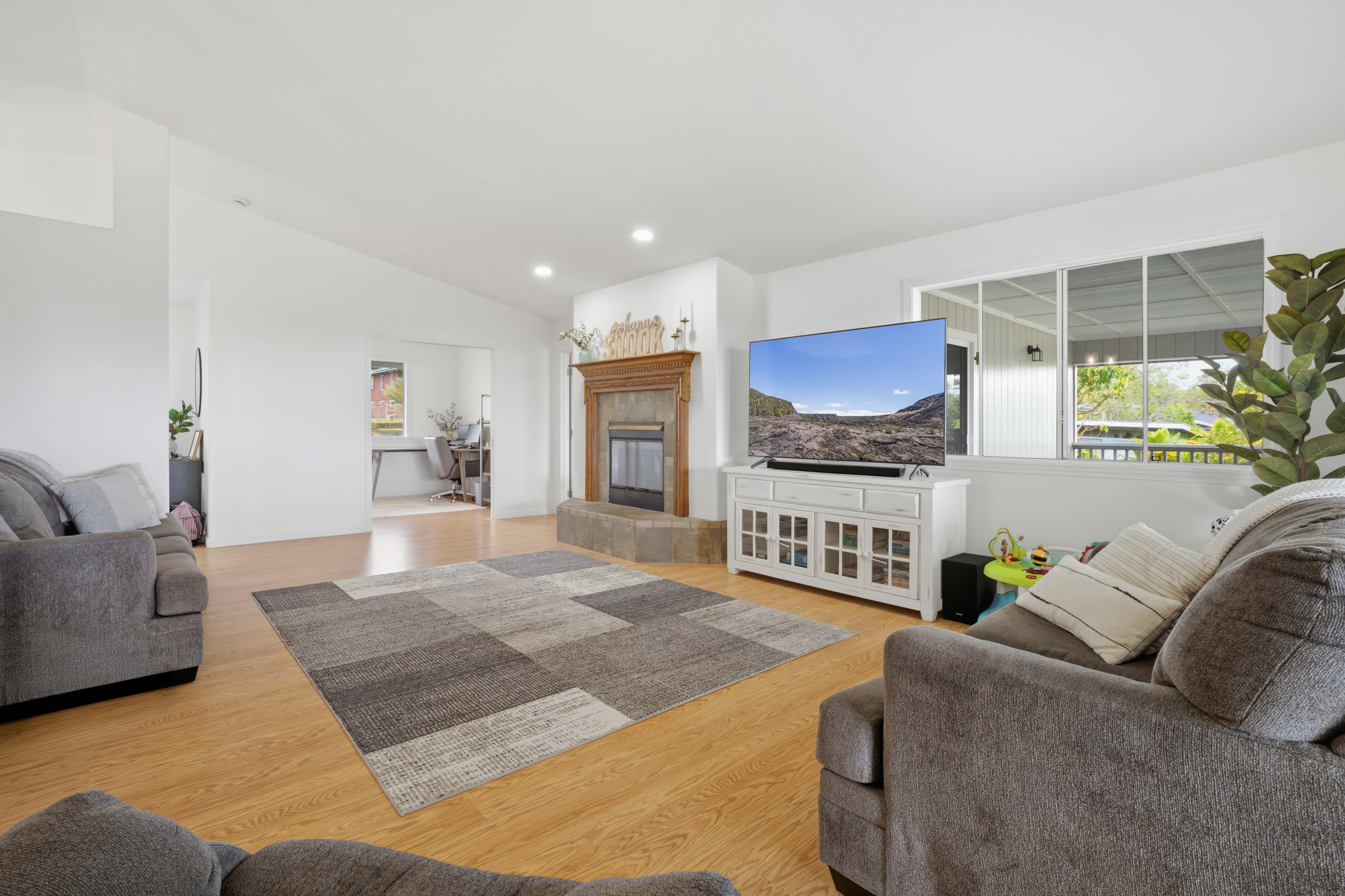 18-3970 Canney Road Mountain View, HI 96771 - Photo 6 of 30 a living room with furniture and a fireplace