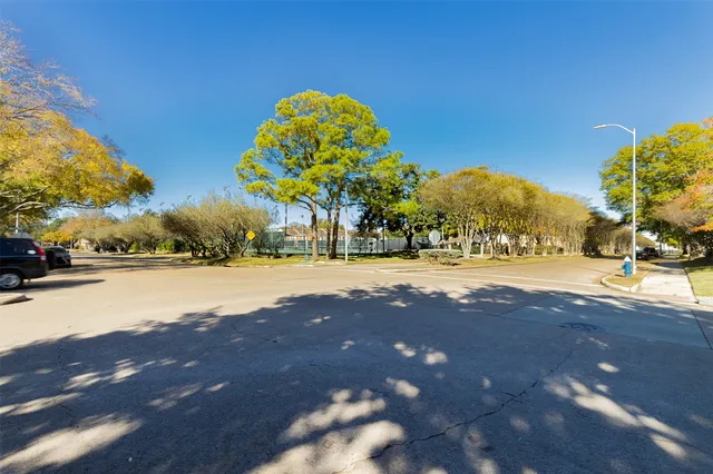 a view of a swimming pool with a yard