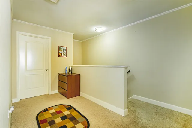 a bedroom with a bed and ceiling fan