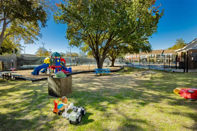 a view of swimming pool with lounge chairs