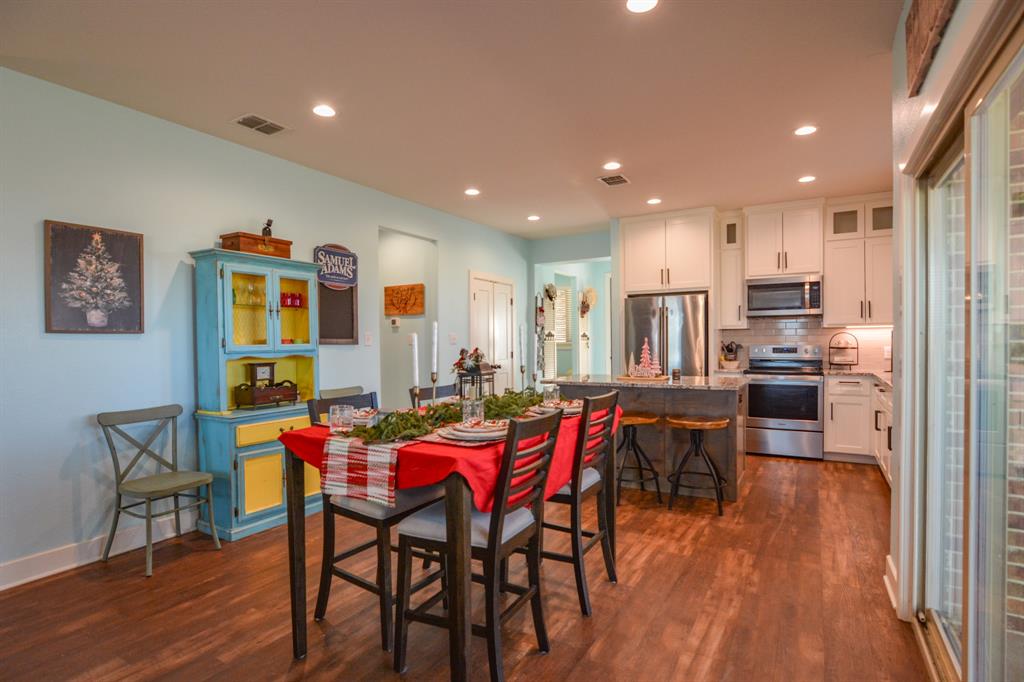 601 Mathew Street Grandview, TX 76050 - Photo 14 of 40 a view of a dining room with furniture and wooden floor