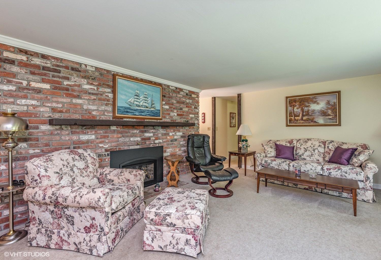 366 Nottingham Drive Centerville, MA 02632 - Photo 5 of 15 a living room with furniture and a fireplace