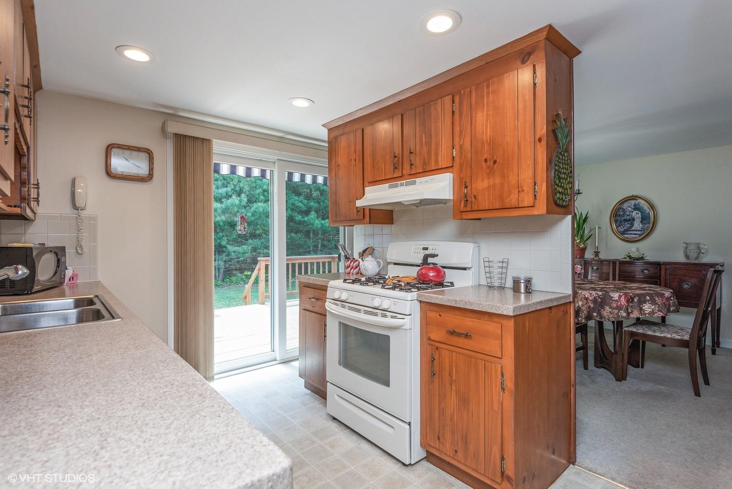 366 Nottingham Drive Centerville, MA 02632 - Photo 8 of 15 a kitchen with stainless steel appliances granite countertop a stove a sink and a refrigerator