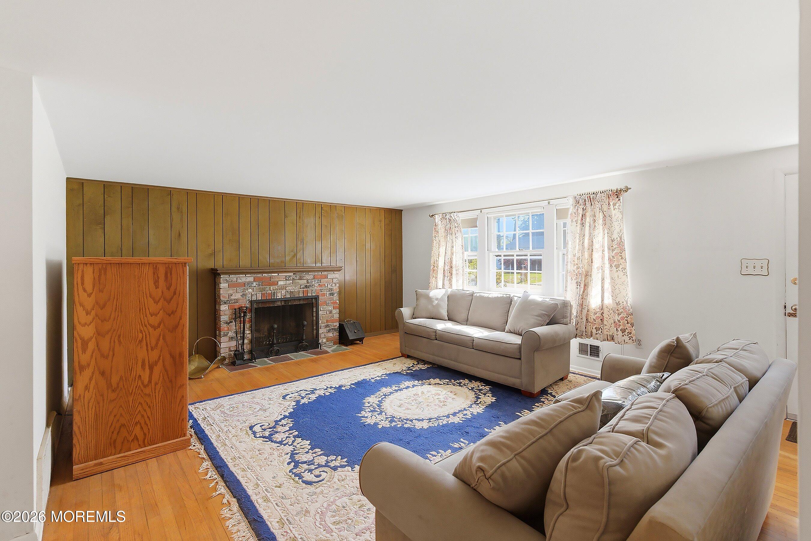 464 Newport Road Forked River, NJ 08731 - Photo 7 of 23 a living room with furniture and a fireplace
