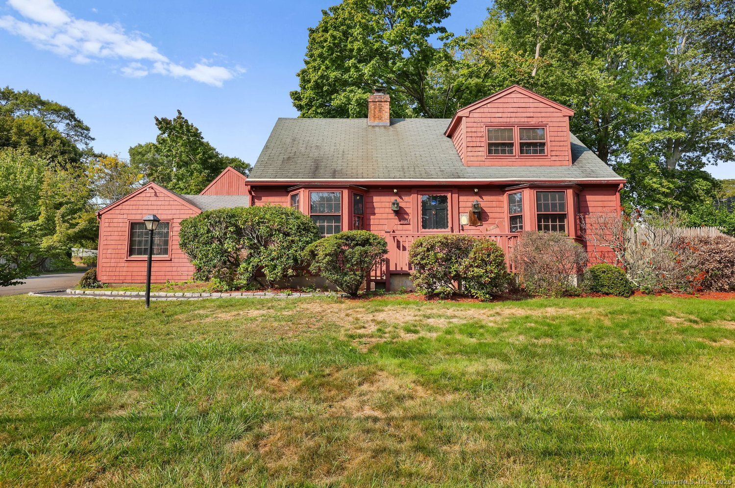 1646 Jennings Road Fairfield, CT 06824 - Photo 1 of 1 a front view of a house with a yard