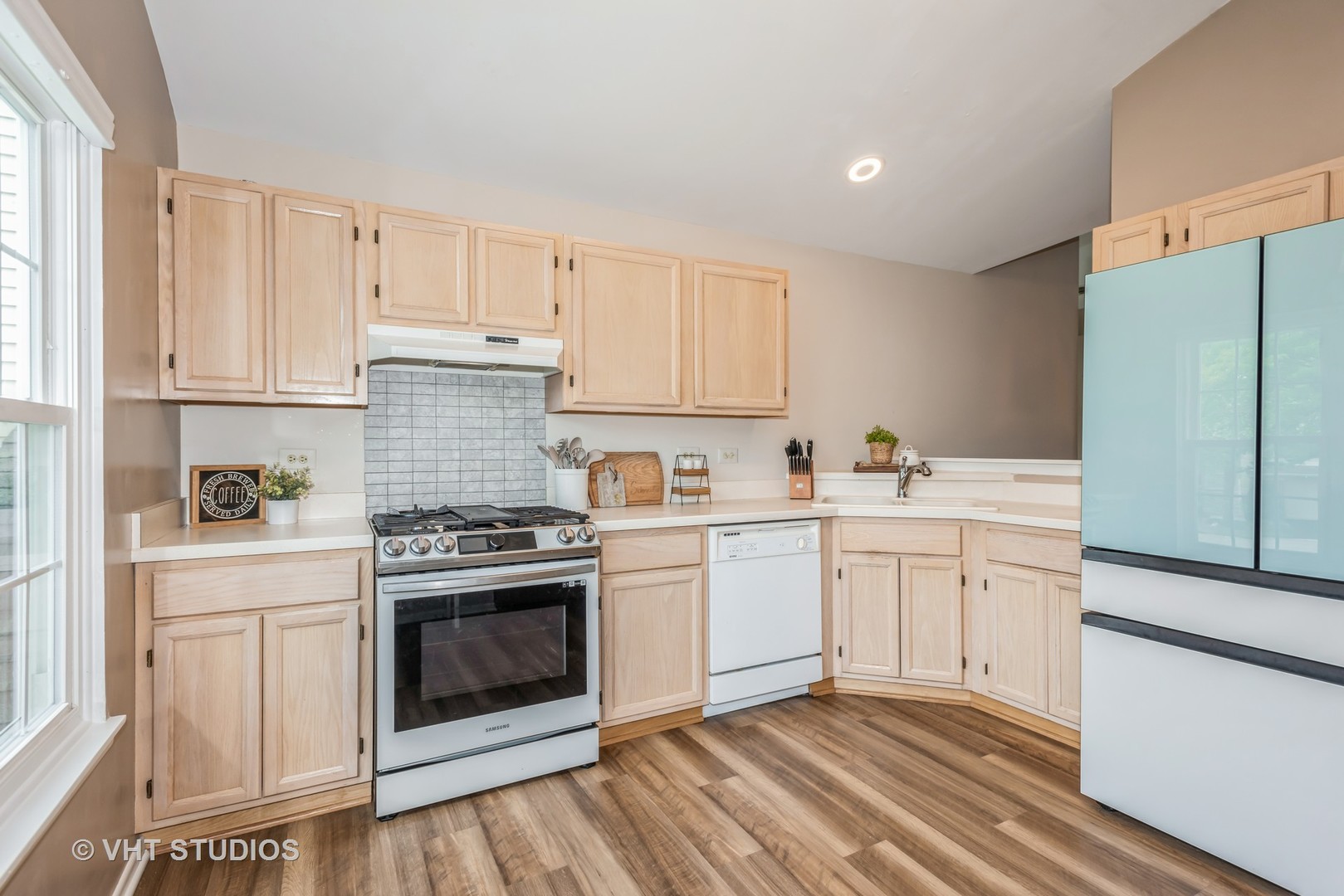 370 Ashford Circle, Unit 2 Bartlett, IL 60103 - Photo 6 of 13 a kitchen with granite countertop white cabinets and white appliances