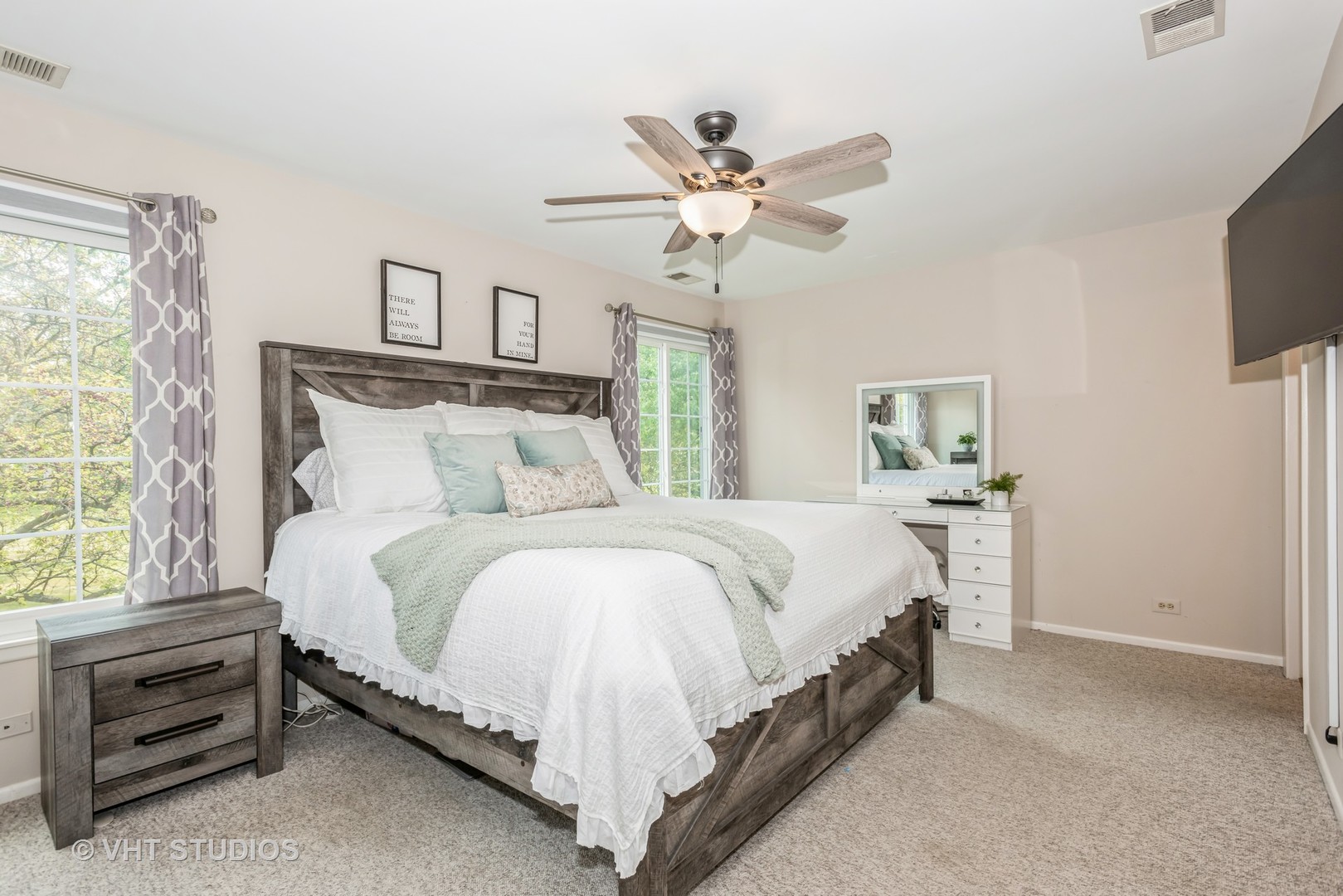 370 Ashford Circle, Unit 2 Bartlett, IL 60103 - Photo 8 of 13 a bedroom with a bed and a chandelier