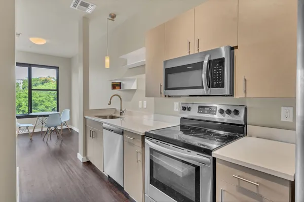 a kitchen with a stove and a microwave