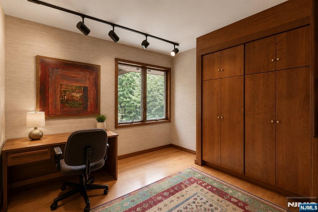 34 Cambridge Way Alpine, NJ 07620 - Photo 20 of 48 a workspace with wooden floor and a window