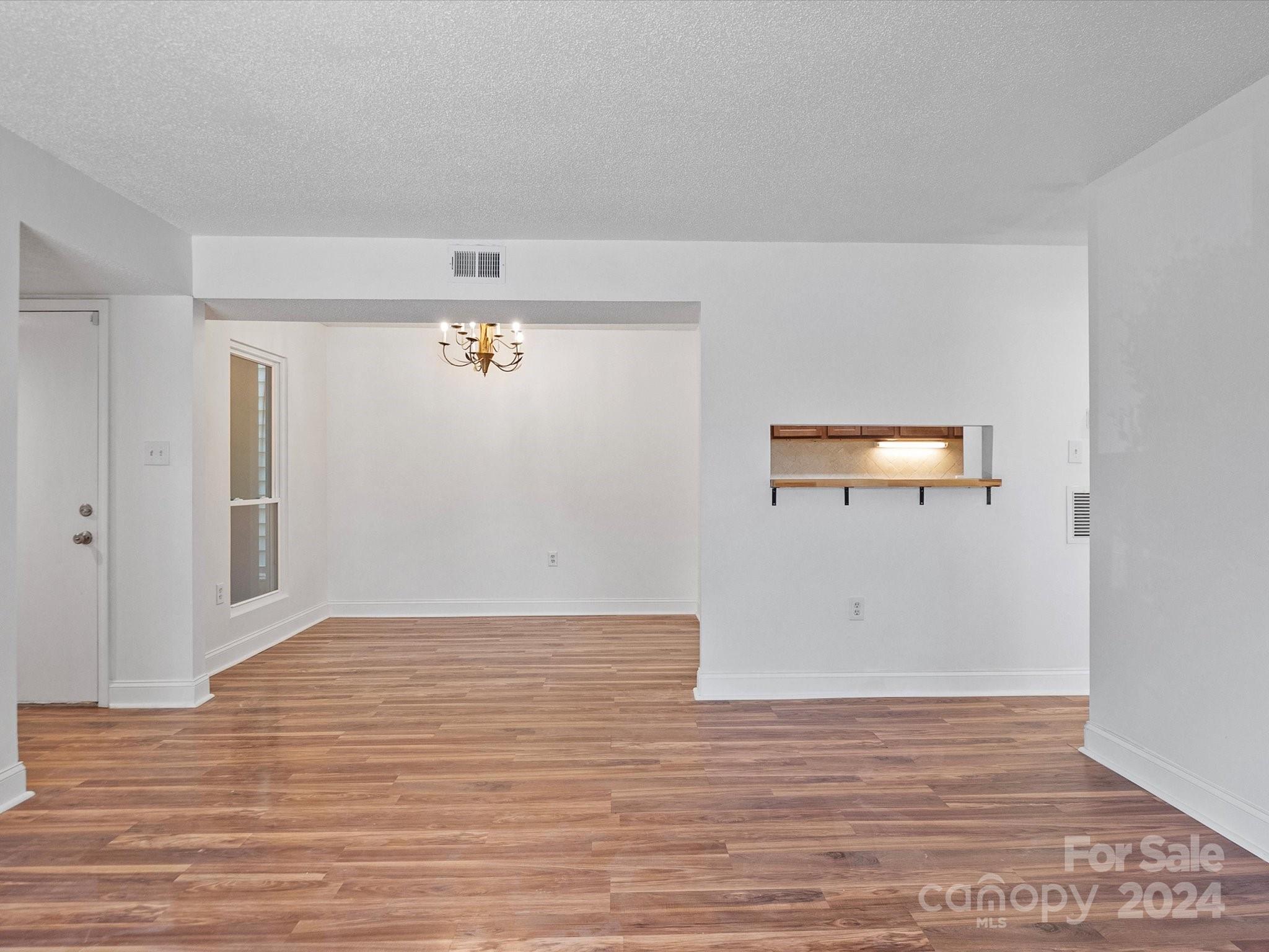 4906 Sardis Road, Unit F Charlotte, NC 28270 - Photo 11 of 30 a view of a livingroom with wooden floor