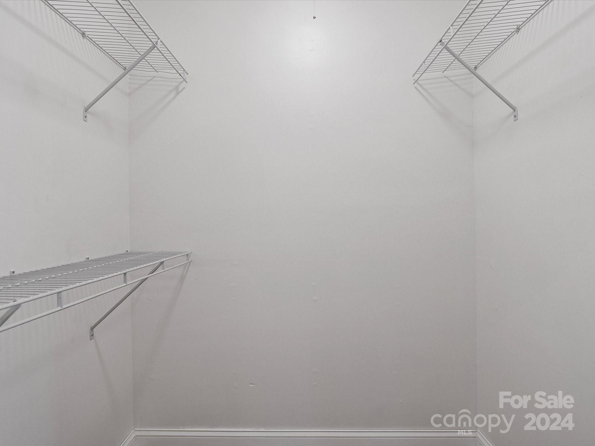 4906 Sardis Road, Unit F Charlotte, NC 28270 - Photo 24 of 30 a view of small space with racks on the wall