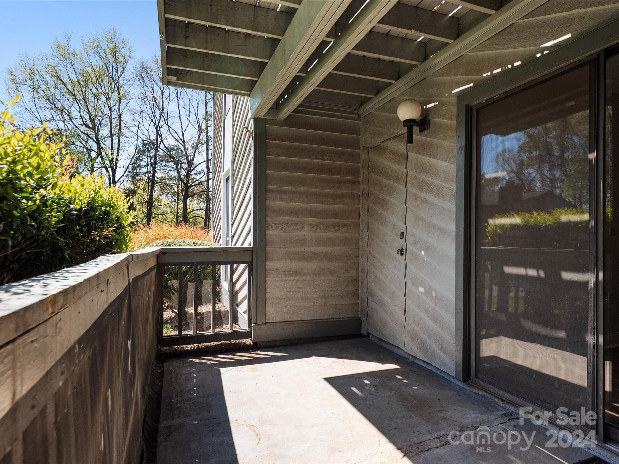 4906 Sardis Road, Unit F Charlotte, NC 28270 - Photo 30 of 30 a view of balcony with wooden floor