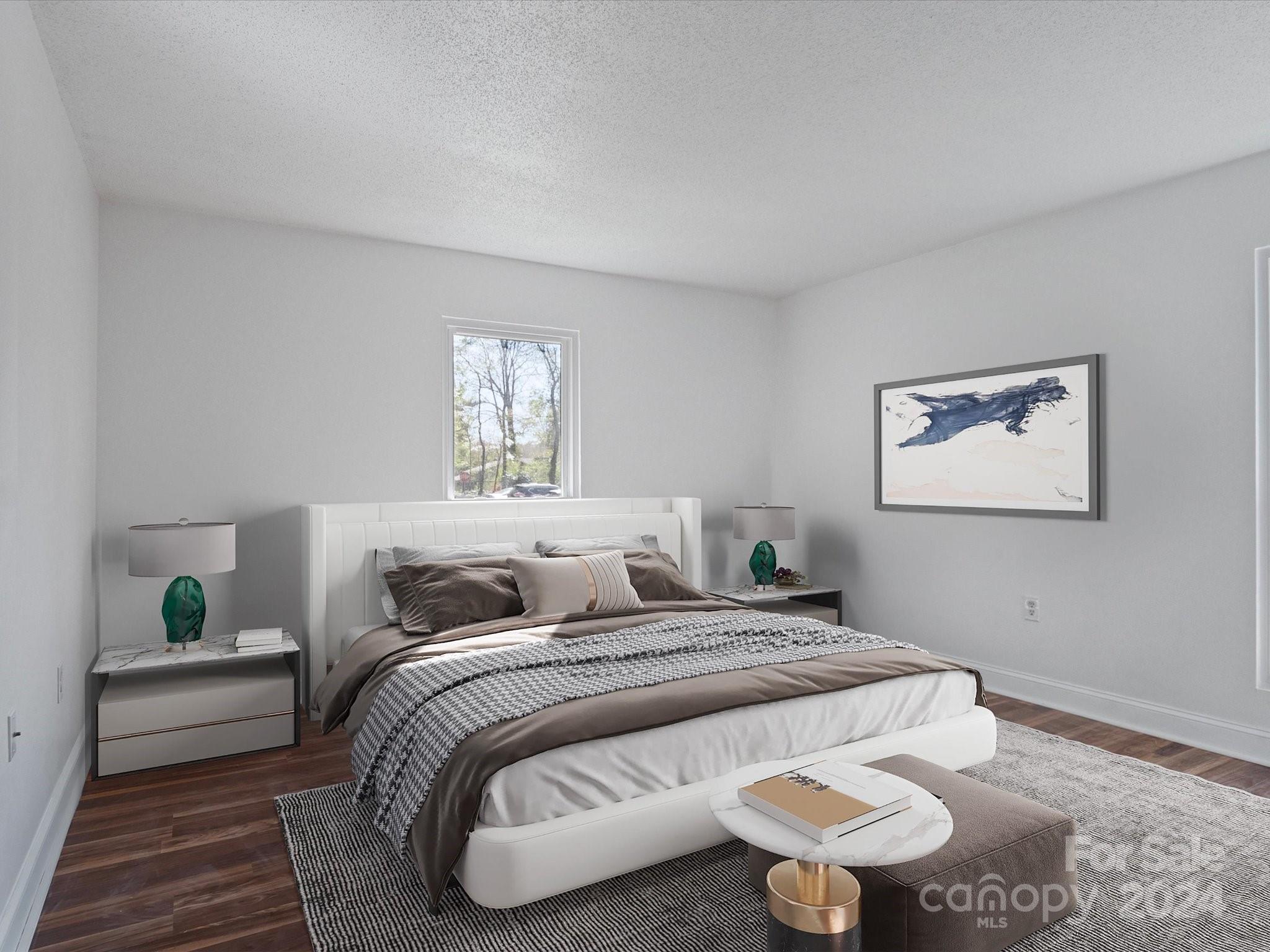 4906 Sardis Road, Unit F Charlotte, NC 28270 - Photo 3 of 30 a bedroom with a bed and a painting on the wall