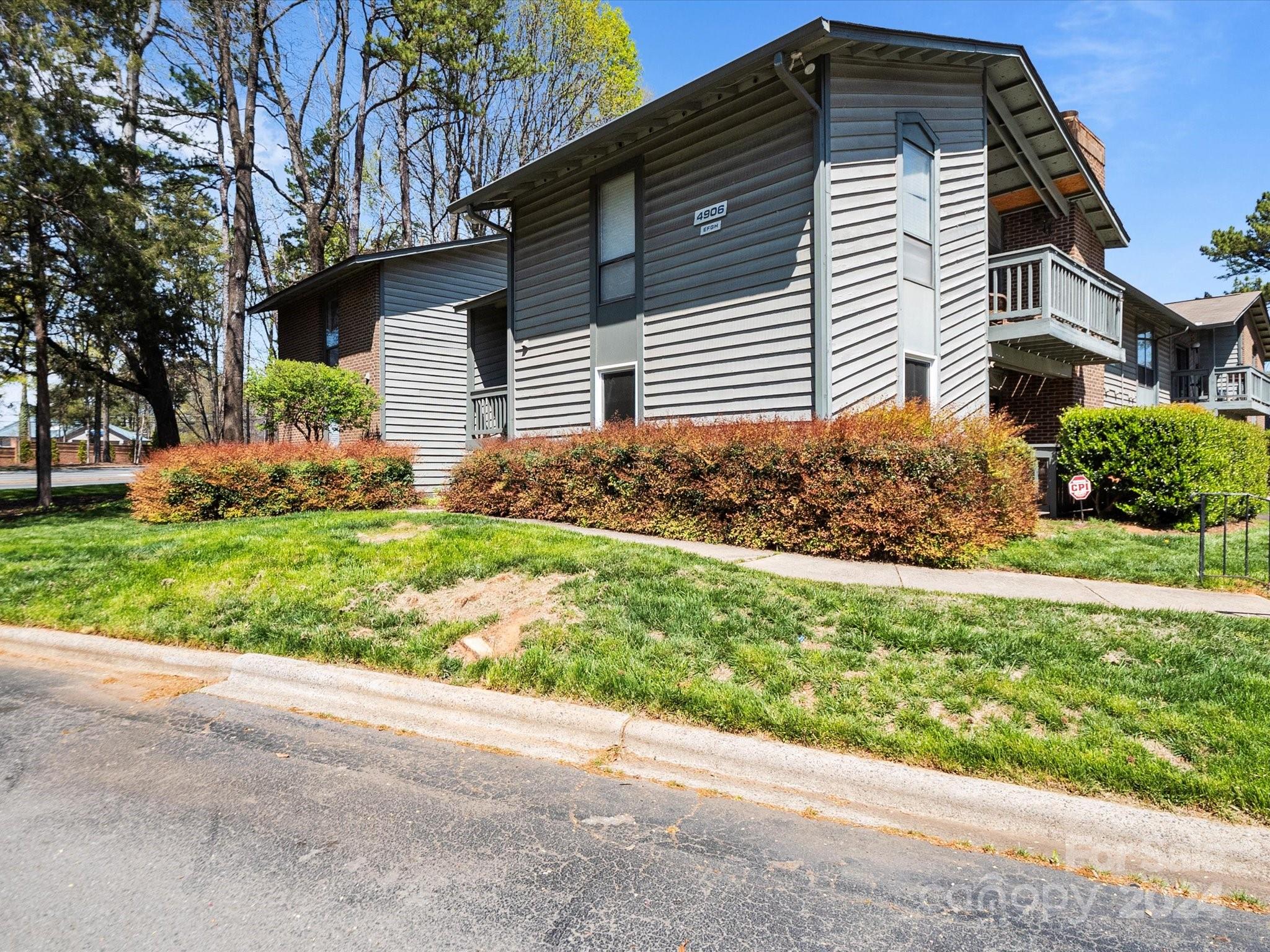4906 Sardis Road, Unit F Charlotte, NC 28270 - Photo 6 of 30 a front view of house with garden