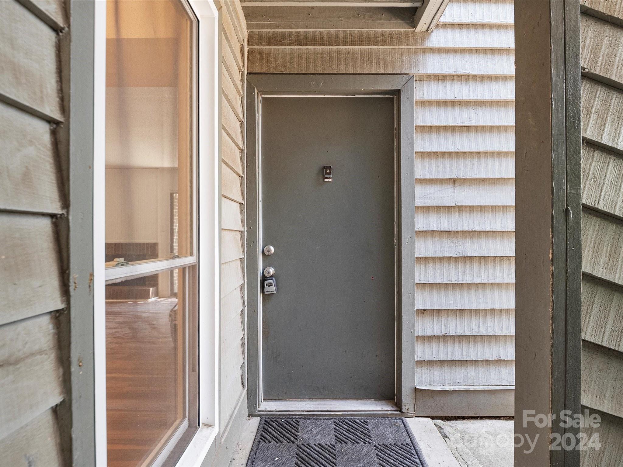 4906 Sardis Road, Unit F Charlotte, NC 28270 - Photo 7 of 30 a view of a room with a door and a window