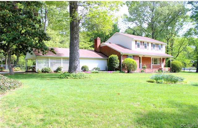 11301 Rochelle Road Chester, VA 23831 - Photo 2 of 17 a front view of a house with garden