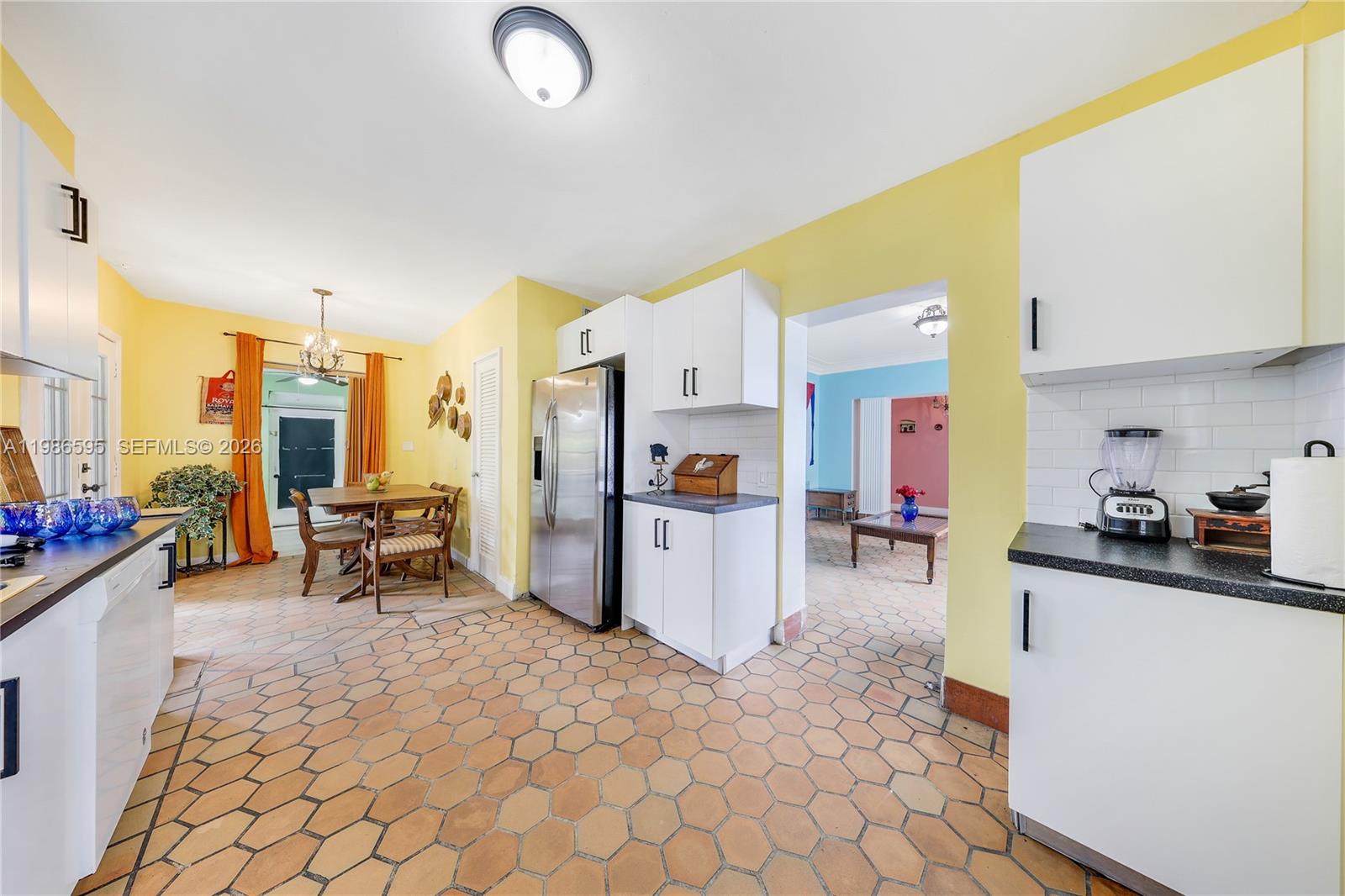843 Northwest 3rd Street, Unit 1 Miami, FL 33128 - Photo 21 of 26 a kitchen with stainless steel appliances a refrigerator and a sink