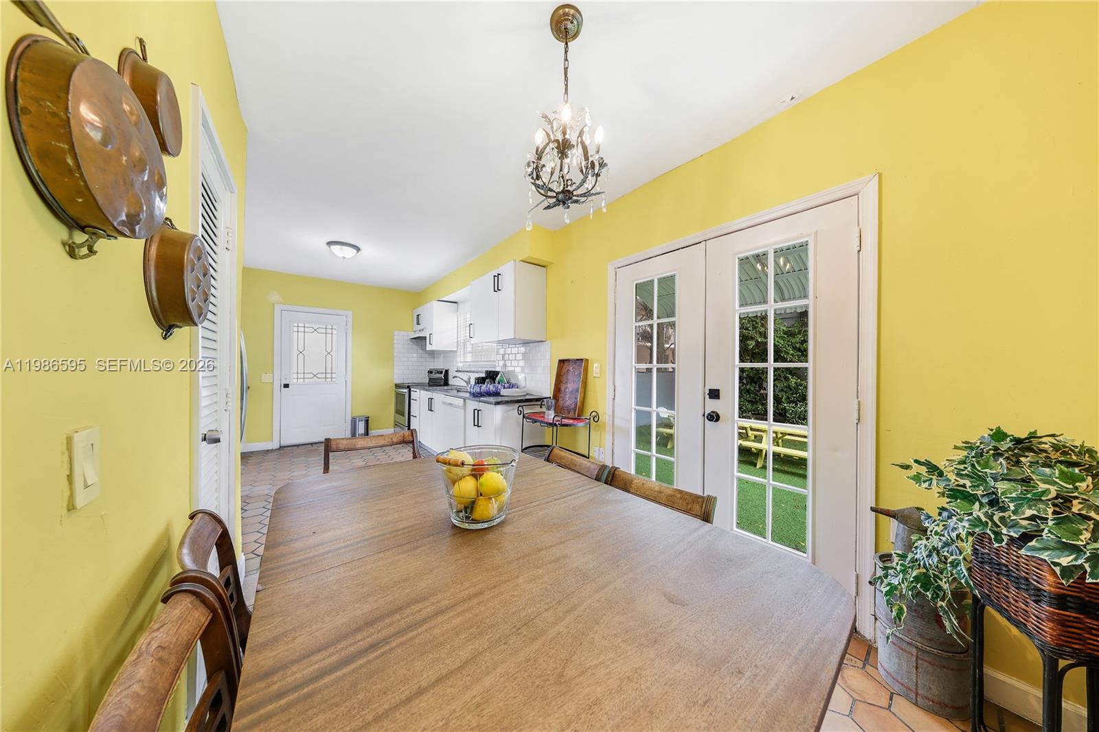 843 Northwest 3rd Street, Unit 1 Miami, FL 33128 - Photo 22 of 26 a view of a dining room with a table and chairs