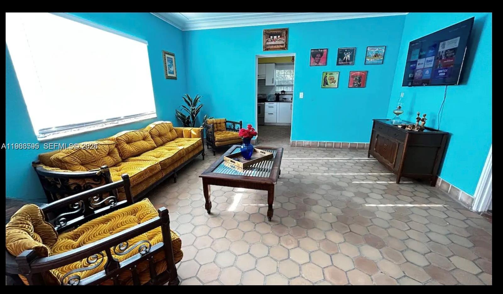 843 Northwest 3rd Street, Unit 1 Miami, FL 33128 - Photo 4 of 26 a living room with furniture and a window