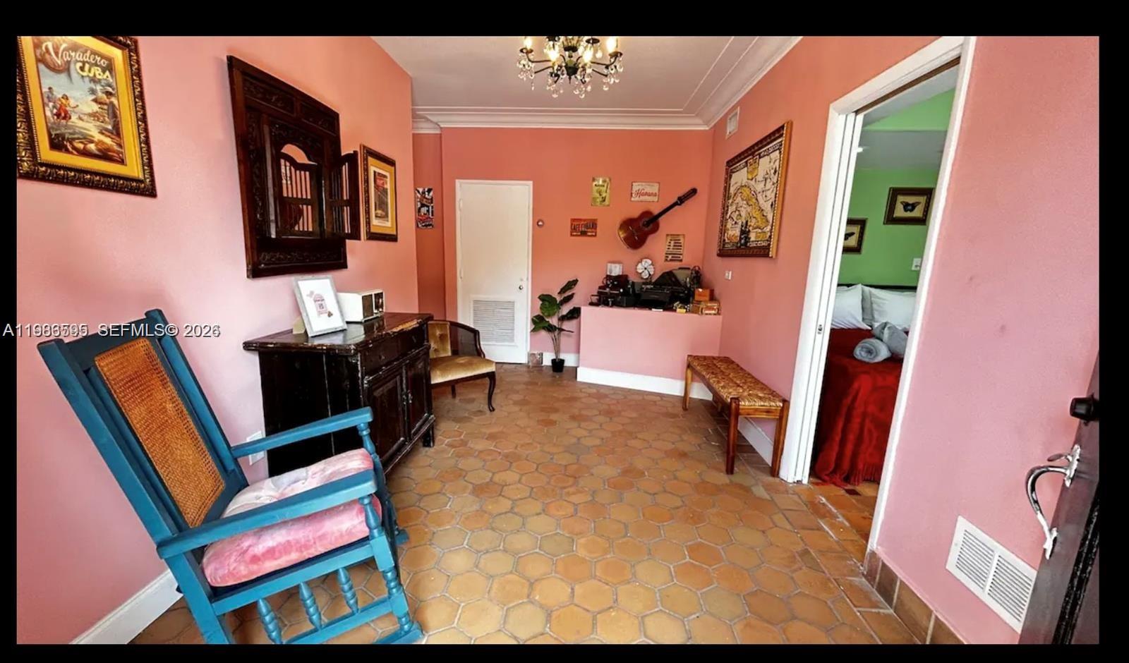 843 Northwest 3rd Street, Unit 1 Miami, FL 33128 - Photo 7 of 26 a living room with furniture and a flat screen tv
