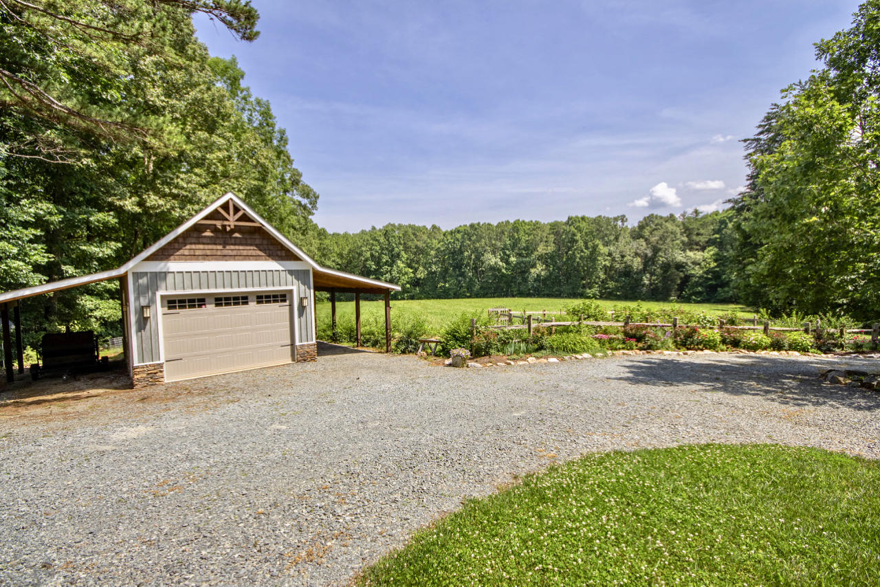 13220 West Gretna Road Sandy Level, VA 24161 - Photo 13 of 48 a front view of a house with a yard and garage