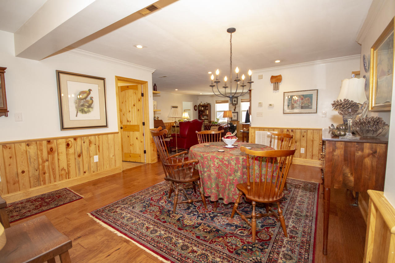13220 West Gretna Road Sandy Level, VA 24161 - Photo 21 of 48 a living room with furniture and a chandelier