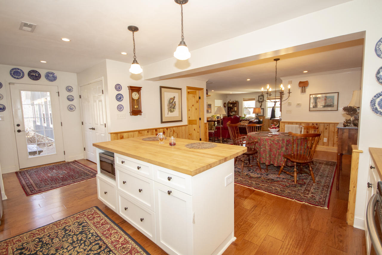 13220 West Gretna Road Sandy Level, VA 24161 - Photo 23 of 48 a large kitchen with stainless steel appliances kitchen island granite countertop a sink and cabinets