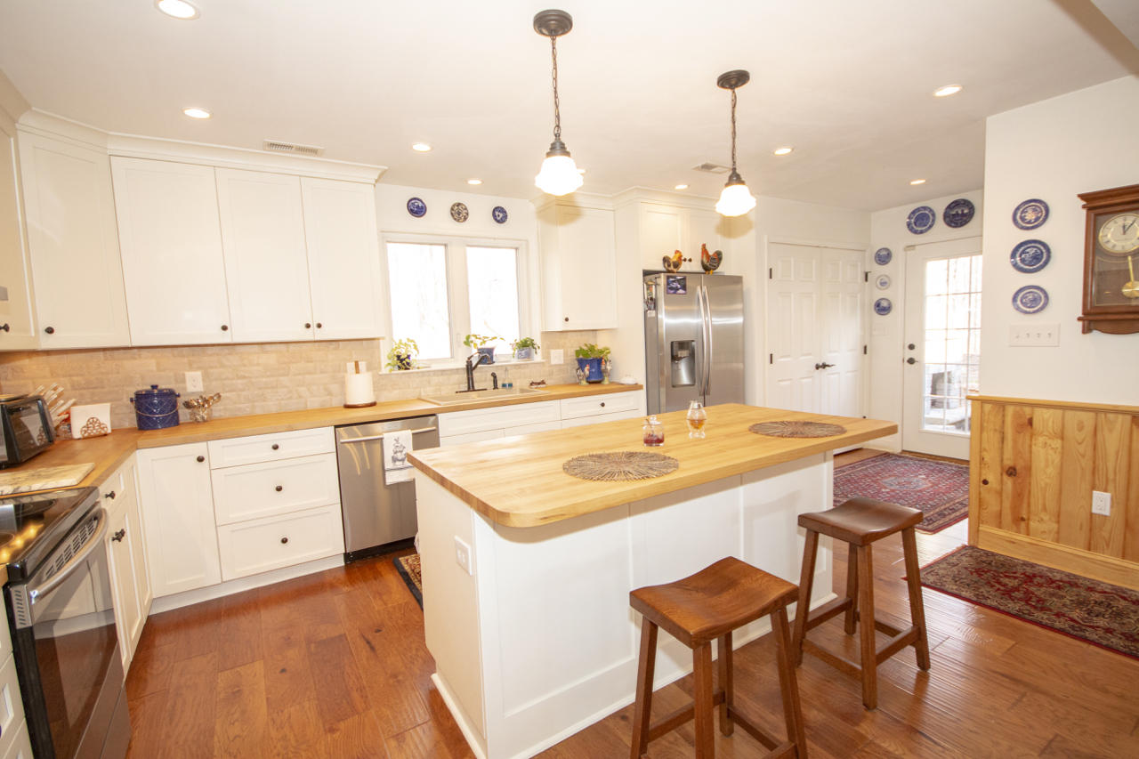 13220 West Gretna Road Sandy Level, VA 24161 - Photo 25 of 48 a kitchen with stainless steel appliances kitchen island granite countertop a sink and cabinets