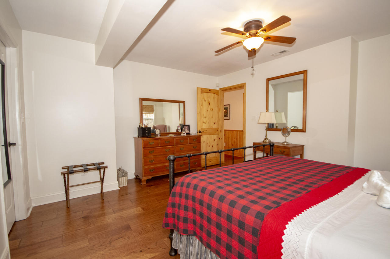 13220 West Gretna Road Sandy Level, VA 24161 - Photo 27 of 48 a bedroom with a bed and a table in it