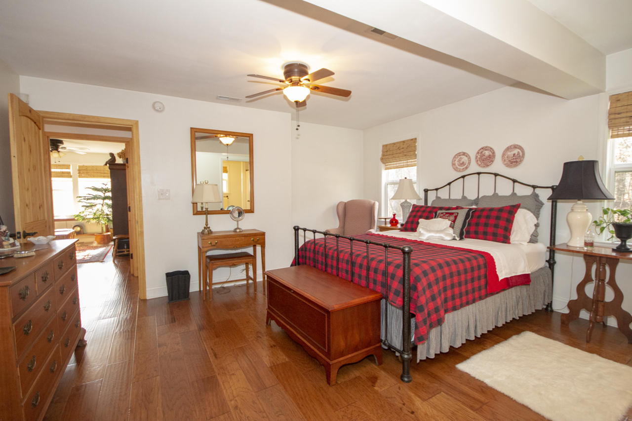 13220 West Gretna Road Sandy Level, VA 24161 - Photo 29 of 48 a bedroom with bed and wooden floor
