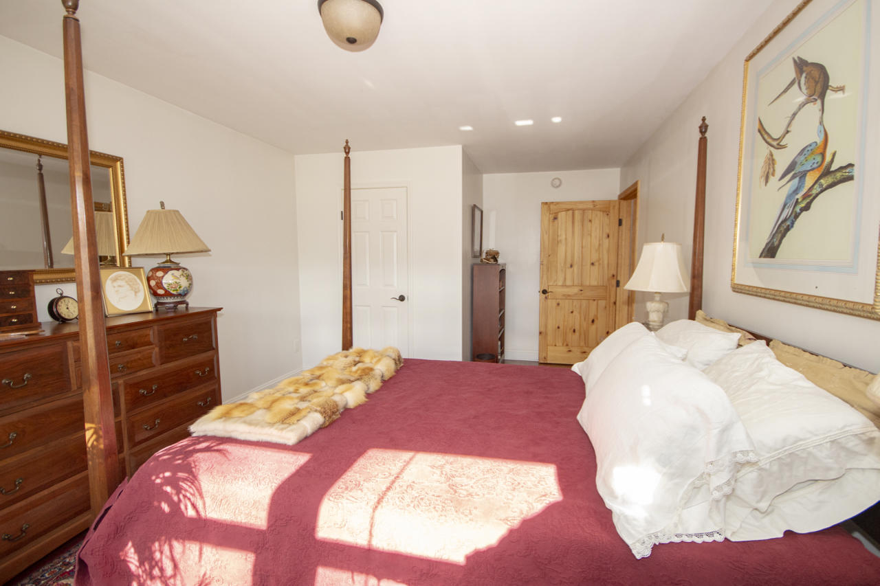 13220 West Gretna Road Sandy Level, VA 24161 - Photo 32 of 48 a bedroom with a large bed and a flat tv screen