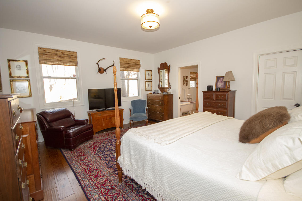 13220 West Gretna Road Sandy Level, VA 24161 - Photo 42 of 48 a bedroom with a bed and wooden floor